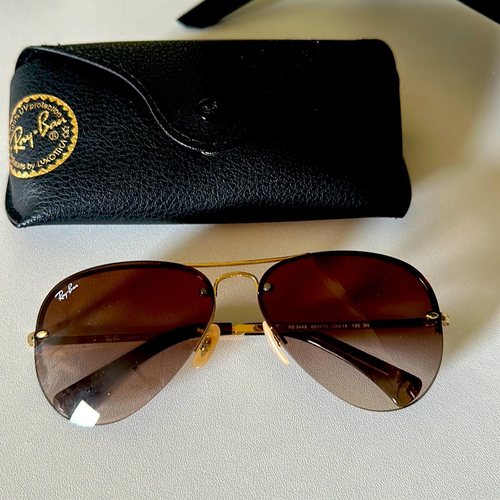 Brown/ dark lens with gold frames. Gently used, lenses are clear and clean!